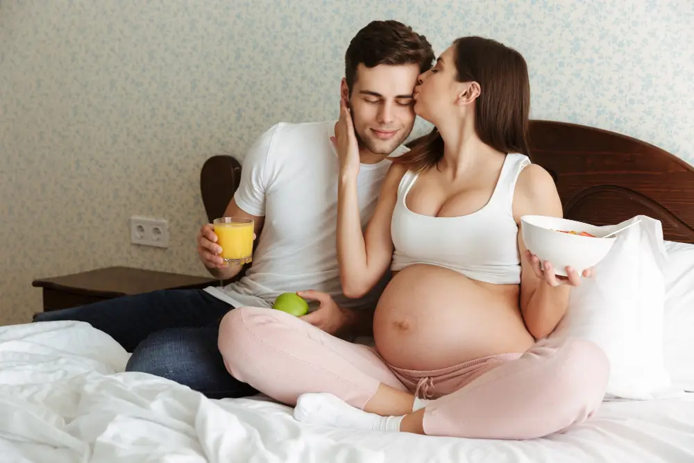 Pregnant woman consulting doctor about painless delivery vs normal delivery options