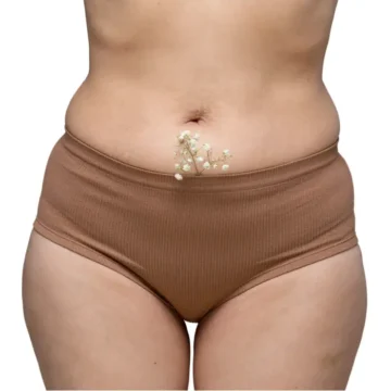 Woman consulting doctor for vaginoplasty surgery and vaginal looseness treatment